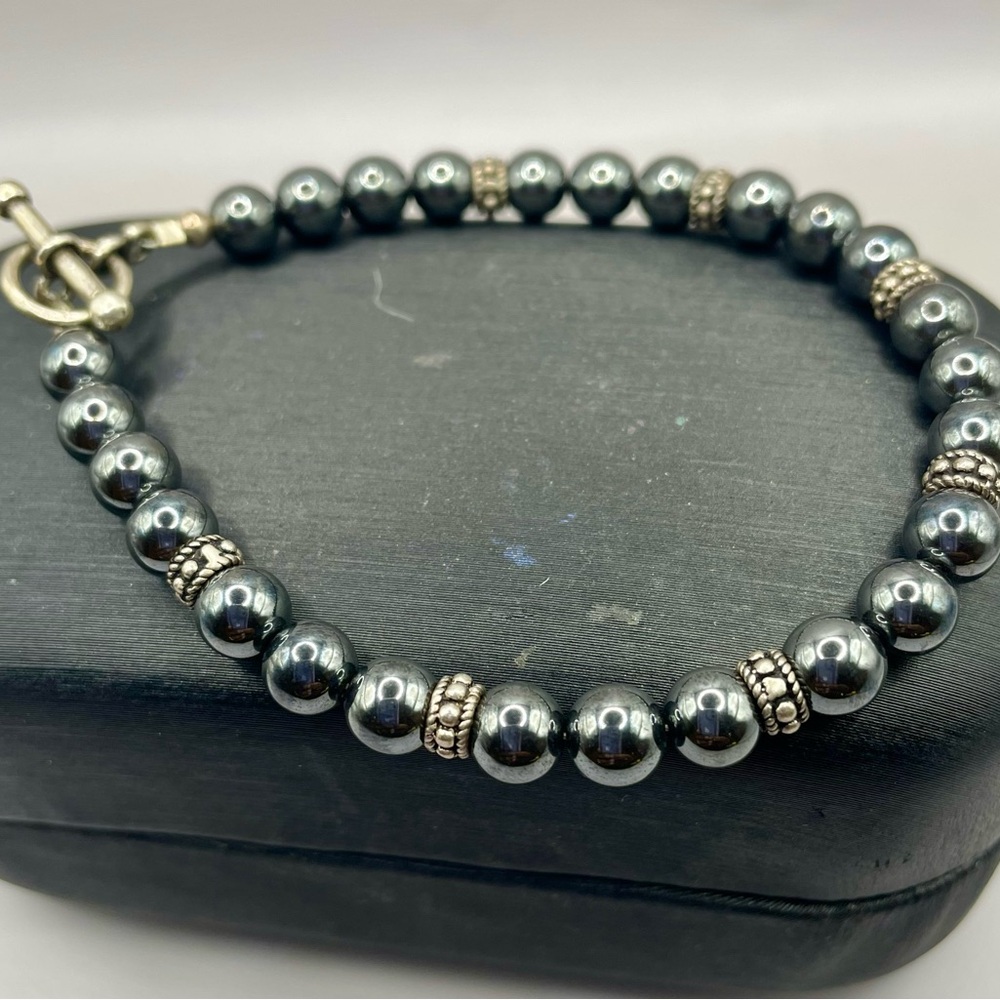 Silver Beaded Hematite Bracelet with Silver Intricate Accents. 7 1/2 inches long